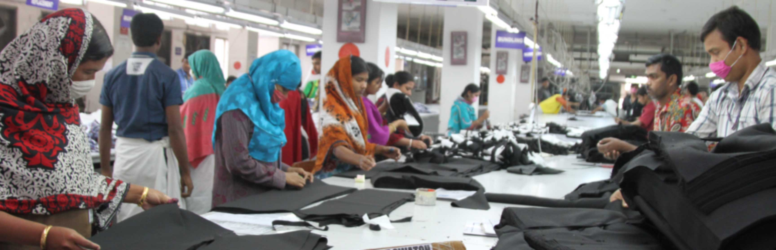 Garment workers sewing at a Shade & Stitch production line